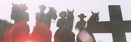 Four outlaws pay respects to their fallen brother, at the hands of Sartana.